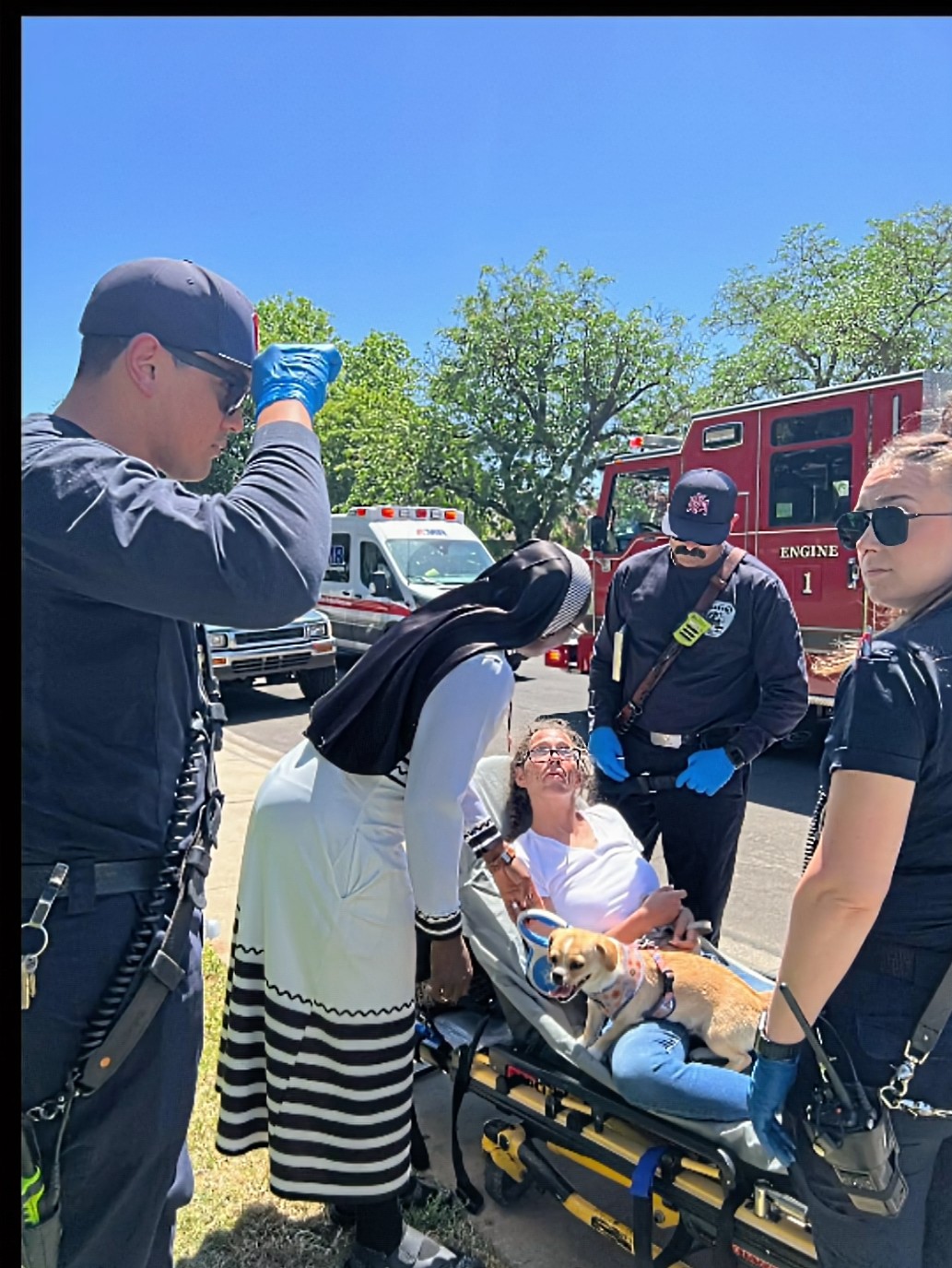 ACMC Sister offering compassionate presence to a sick person during street outreach with emergency responders