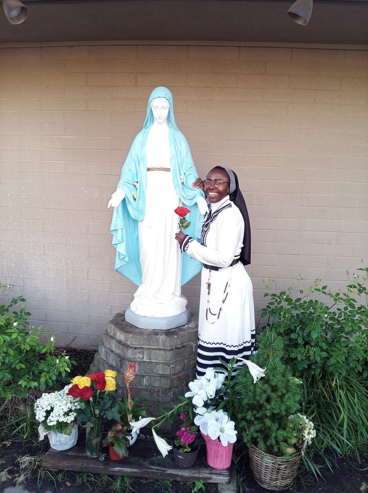 Foundress by Our Lady's statue on the Feast of the Immaculate Conception