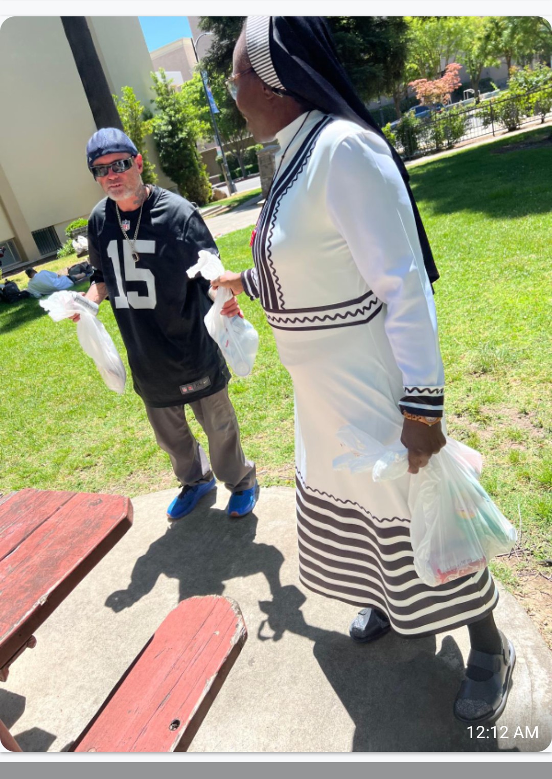 Sister Felicia distributing lunches during street outreach