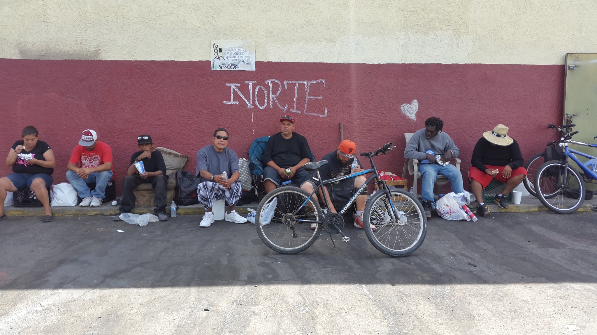 Homeless guests enjoying lunch provided by ACMC